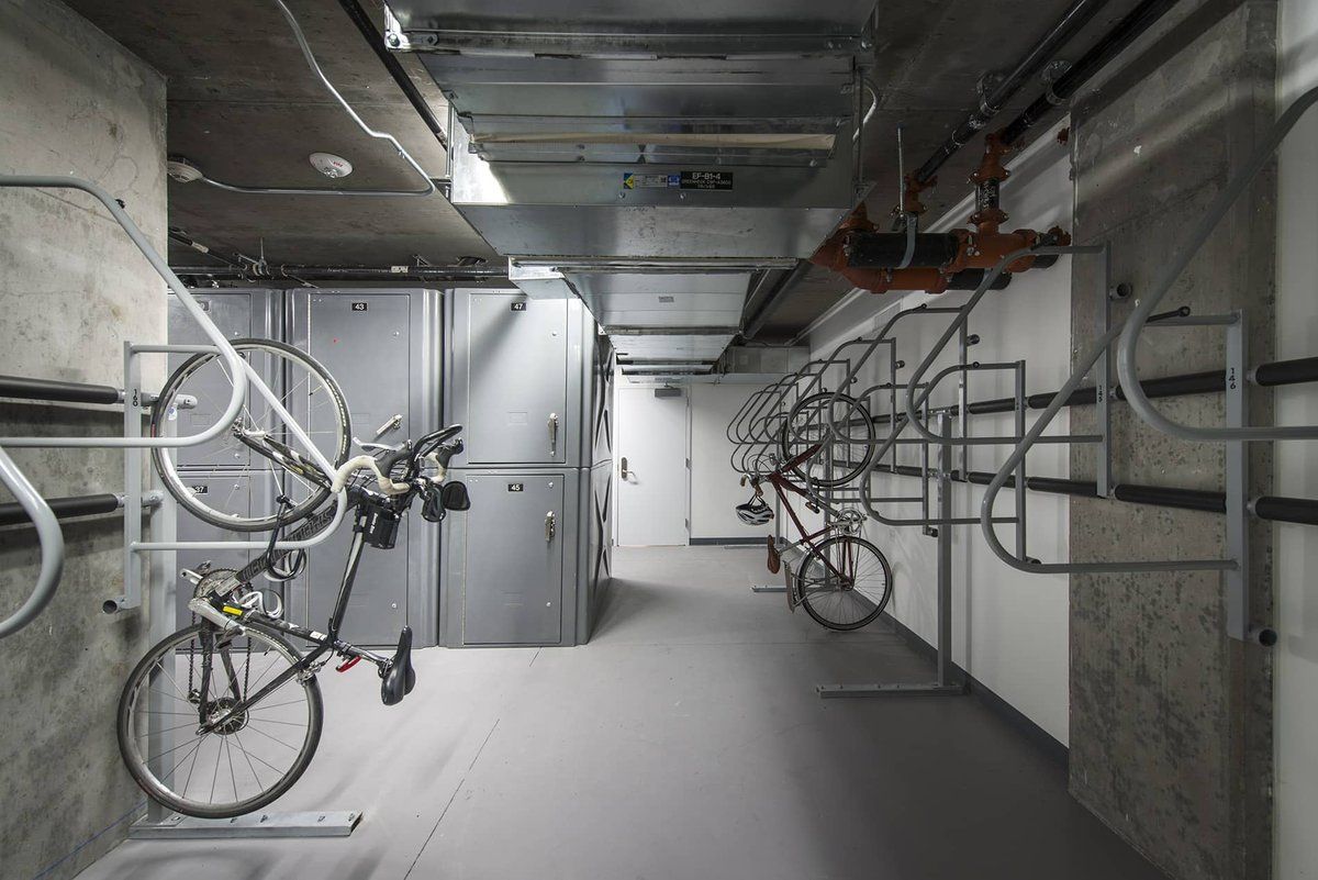 Indoor storage room with wall-mounted bike racks